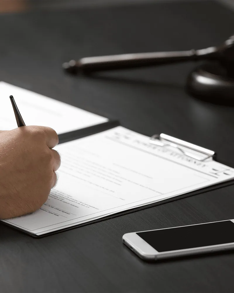 Client signing warrant or FTA bail bond agreement with a Charlotte NC bondsman